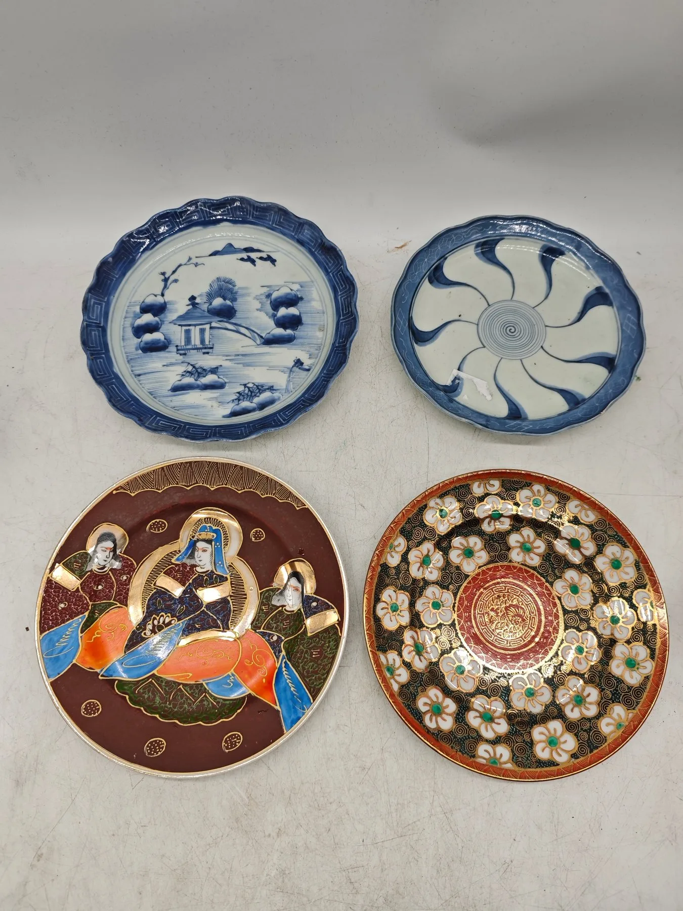 Antique Japanese porcelain. (obdobie Meiji 1868-1912) plate with blue landscape motif and pagodou
