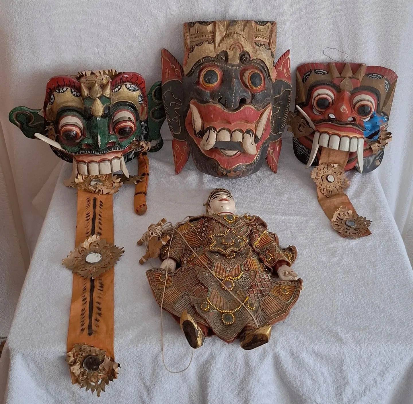 3 wooden ceremonial Barong masky in Bali + gilded and beautiful decorated theatre puppet in Barmy