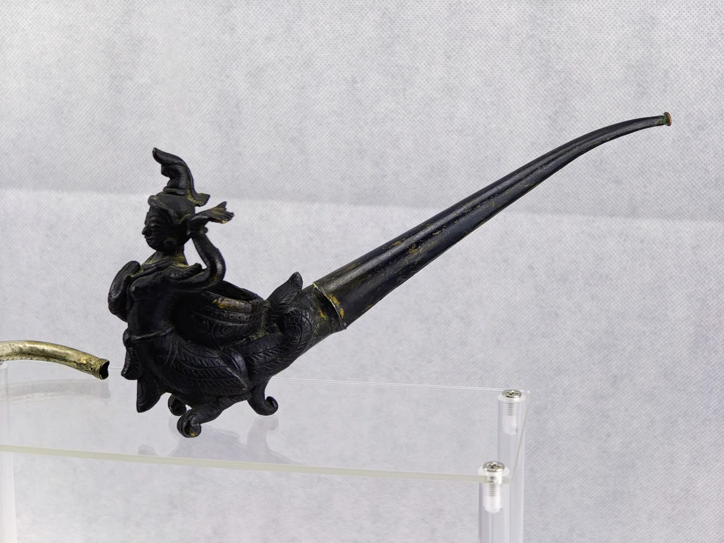 Figural bronze opium pipe in Myanmar