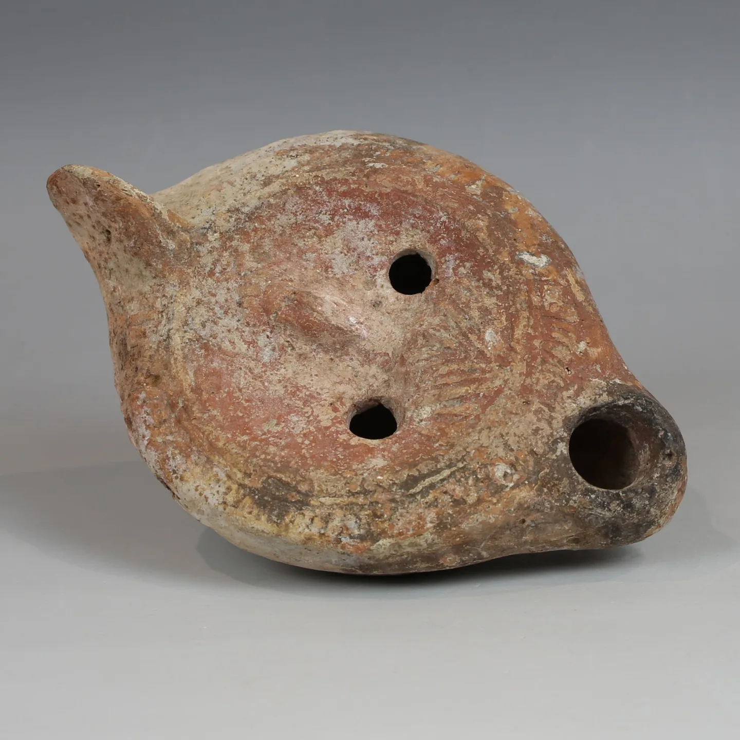 Roman oil lamp in terakoty with vyobrazenou bustou in 2-3st n.l.